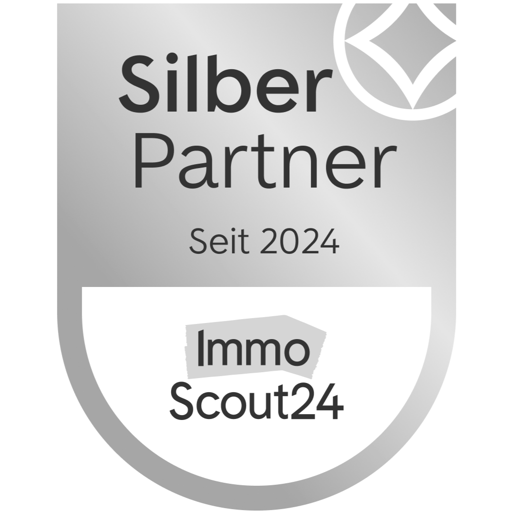 Schild mit der Aufschrift 'Silber Partner Seit 2024' und dem Logo 'ImmoScout24'.