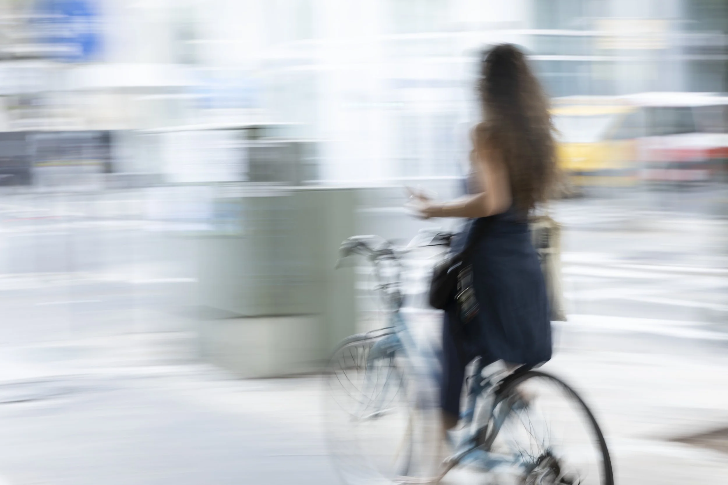 Sarona_Woman_riding_bike_lobby_B_120x80 for imaging.jpg