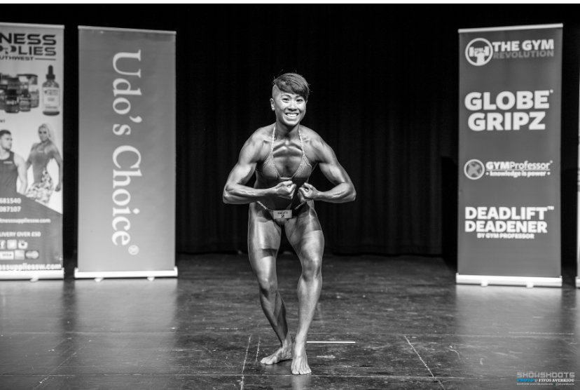 Ann posing during competition
