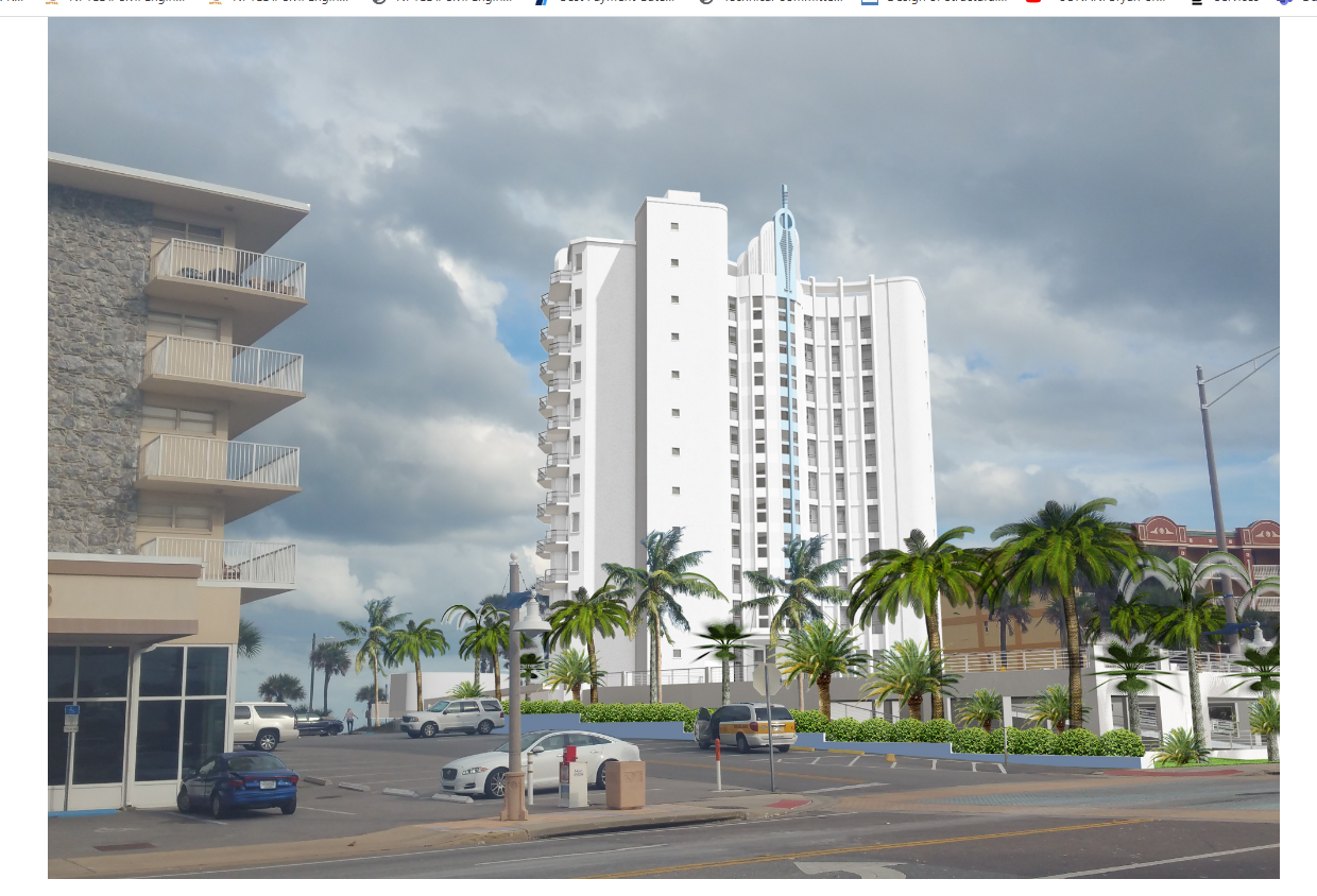 Modern white high-rise building with rounded balconies, palm trees in front, and a parking lot with several cars under a cloudy sky.