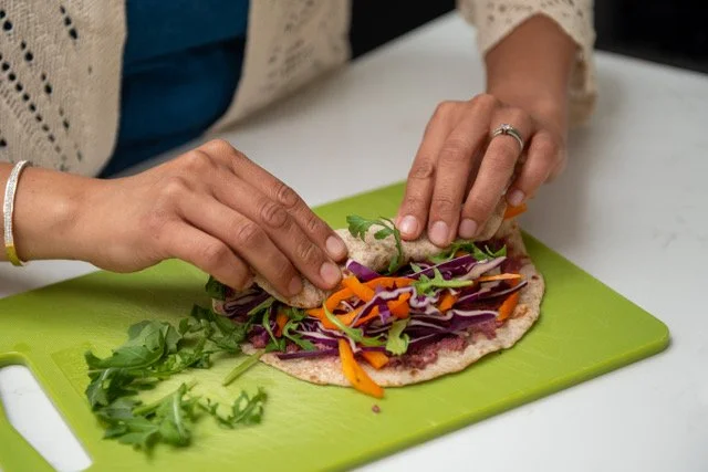 Hands preparing fresh food