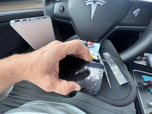 Mobile iPhone repair inside Tesla service vehicle in Miami