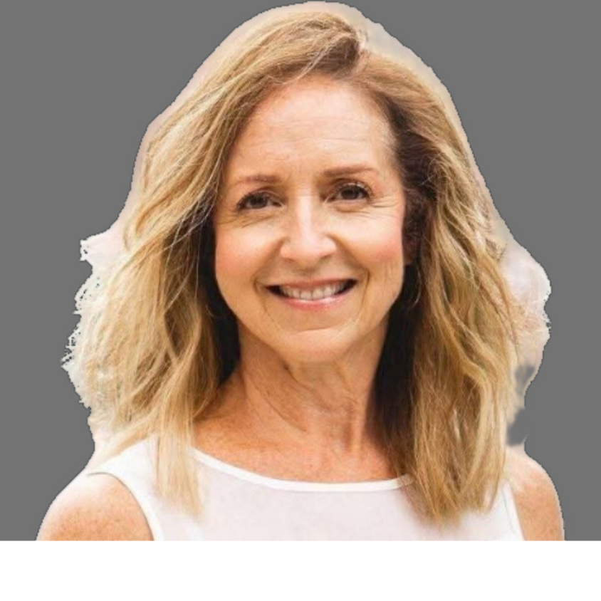 A woman with shoulder-length curly blonde hair smiling at the camera, wearing a white sleeveless top.