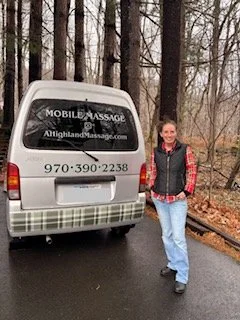Woman standing next to a white van with