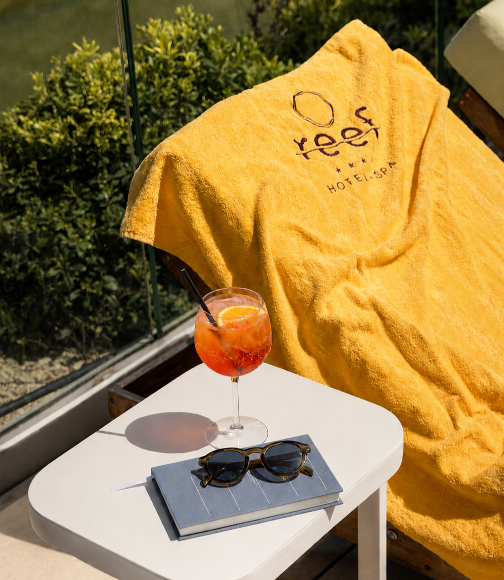 Yellow towel and aperol spritz