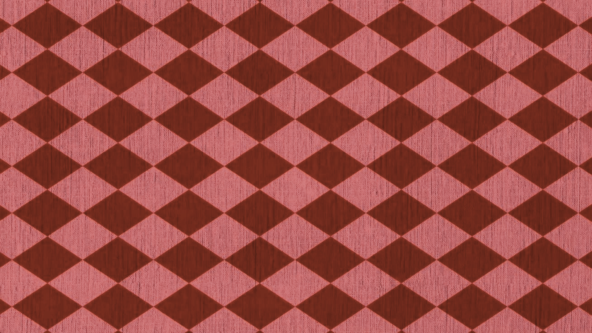 Red and pink diamond pattern on a fabric or wallpaper surface.