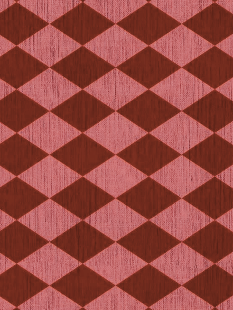Close-up view of a red and pink diamond-patterned fabric or wallpaper.