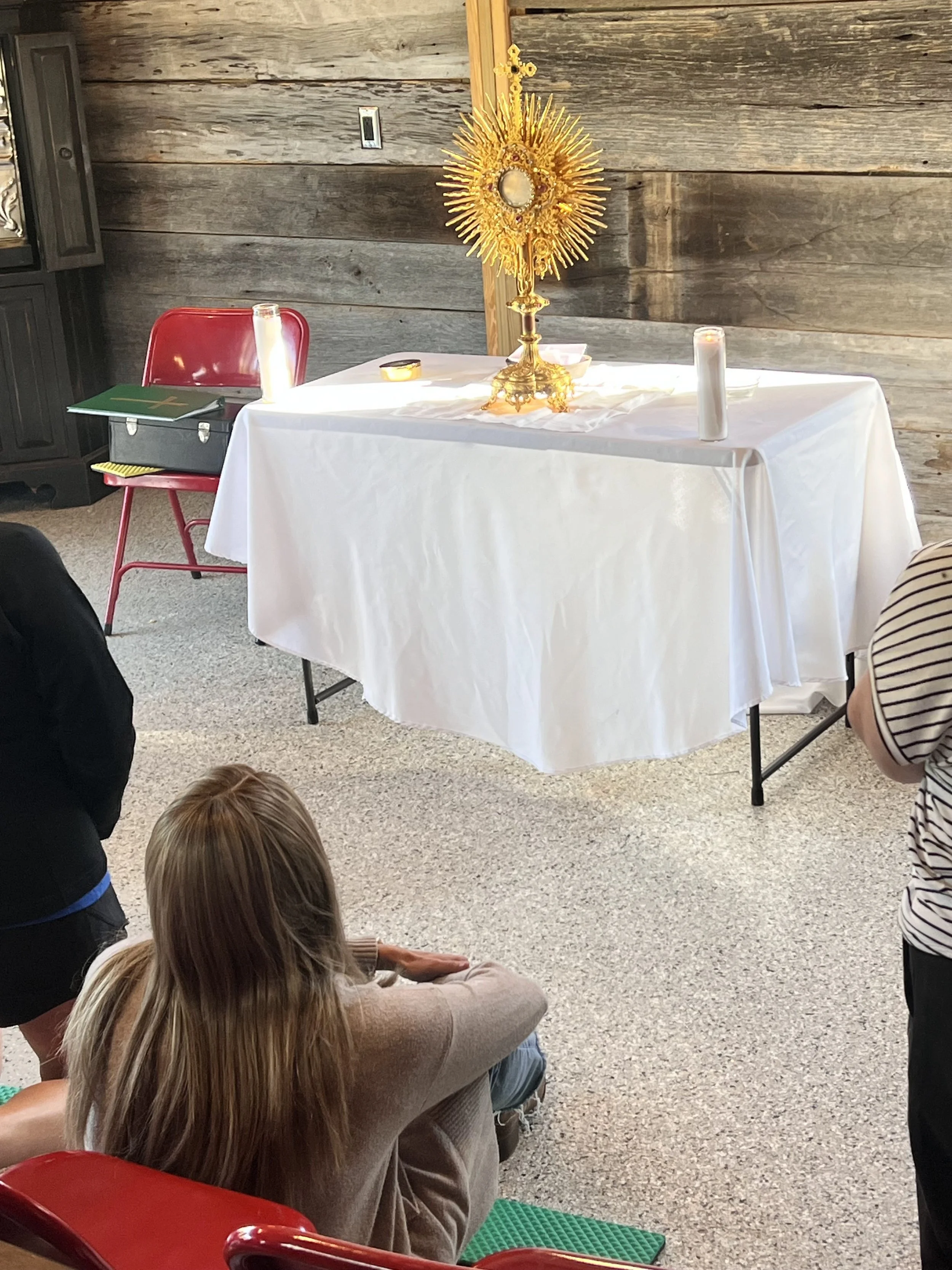 Author Julie Yost praying before the Blessed Sacrament.