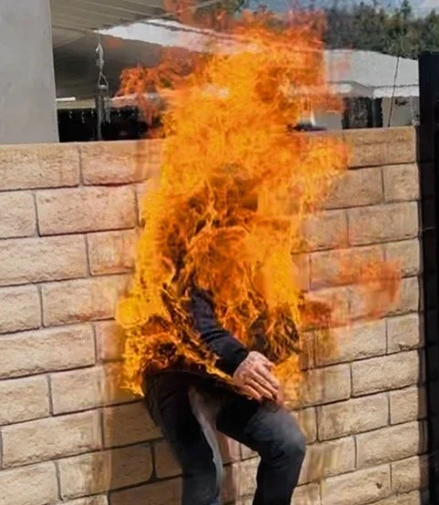 Cory Demeyers doing a full fire burn, Jason Gray as Fire safety.