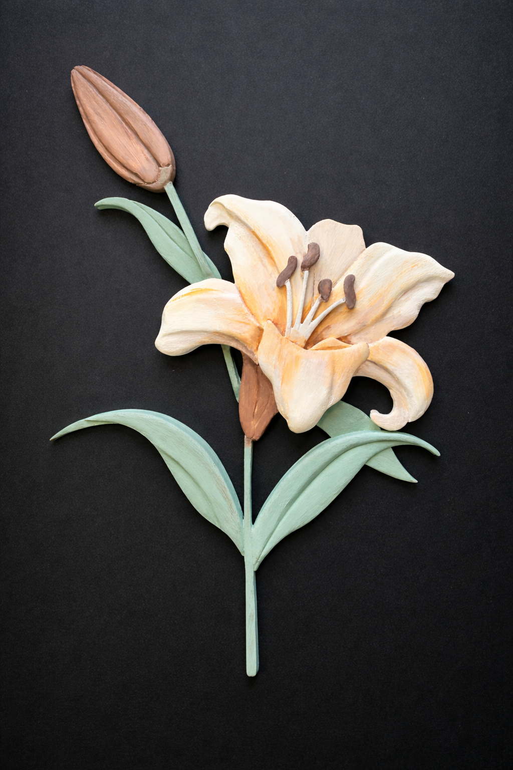 Dimensional wooden wall art of a blooming lily flower with soft peach petals and green leaves on a black background.