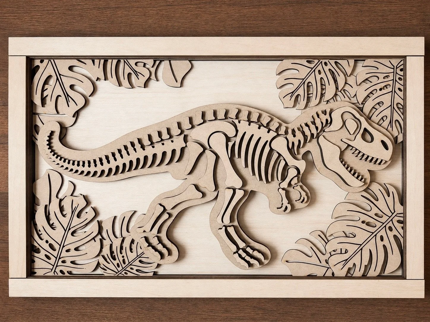 Layered wooden dinosaur skeleton wall art with tropical leaf accents.