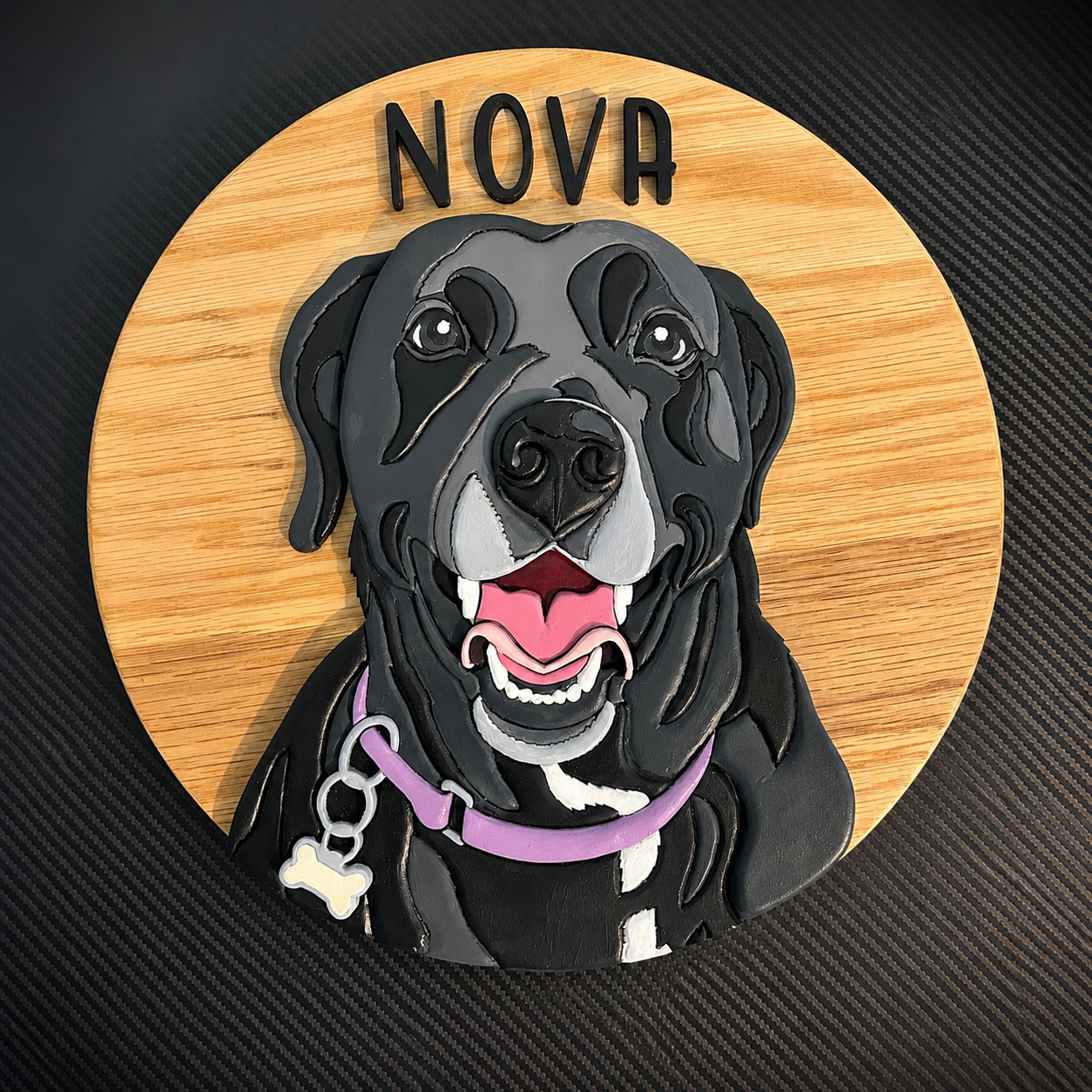 Image of a black lab made out of wood on a round wooden circle.