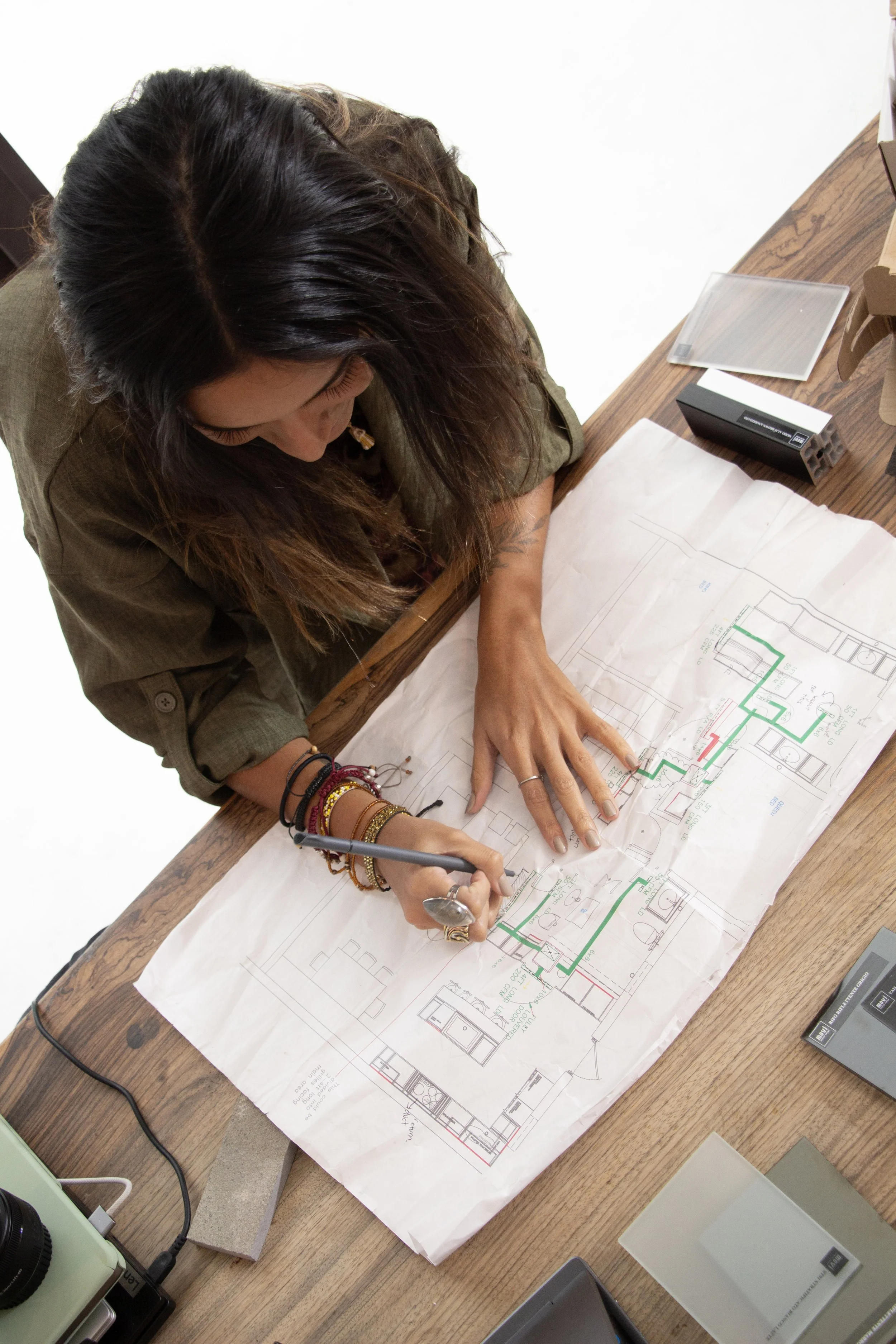 Interior designer drawing and designing and drafting on plans