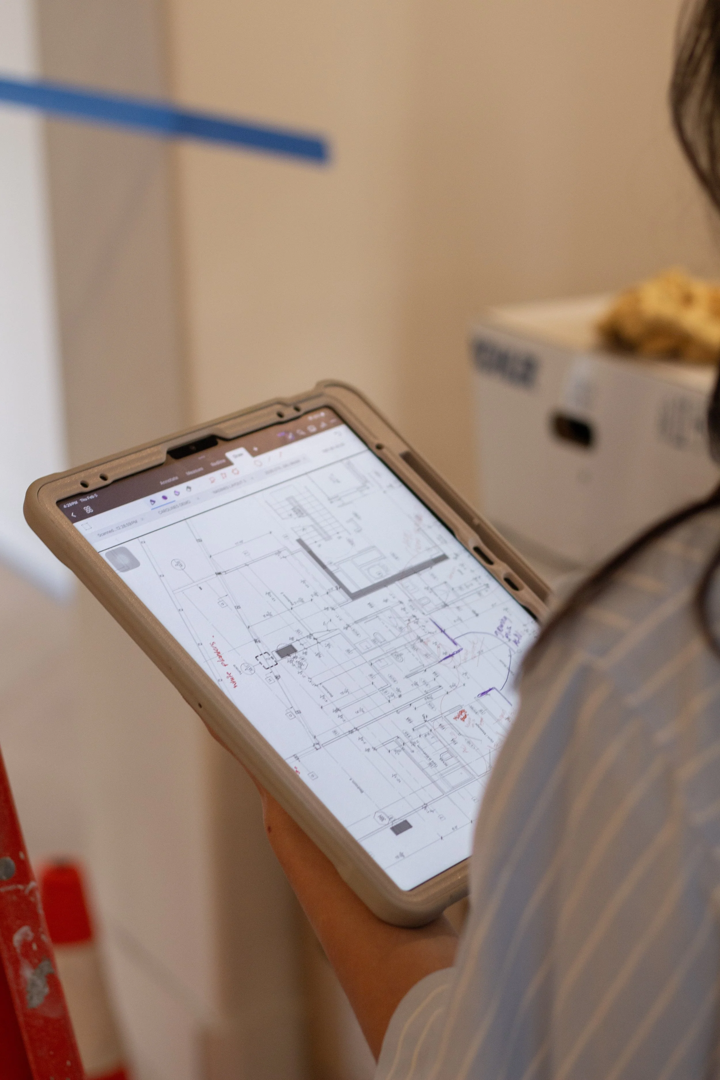 iPad showing an architecture plan with notes