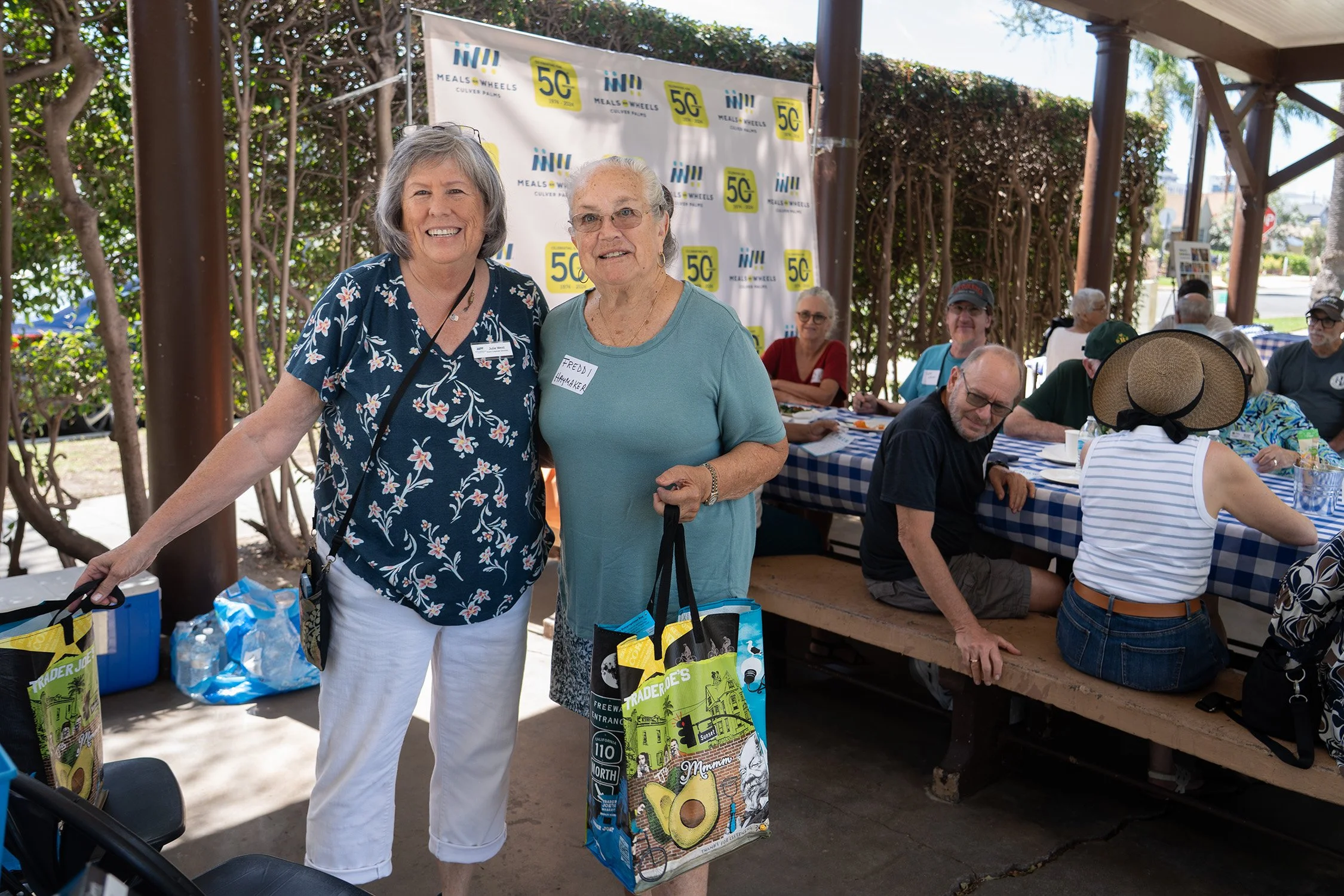 Julie with Freddi volunteer who won TJ_s Shopping bag..jpg
