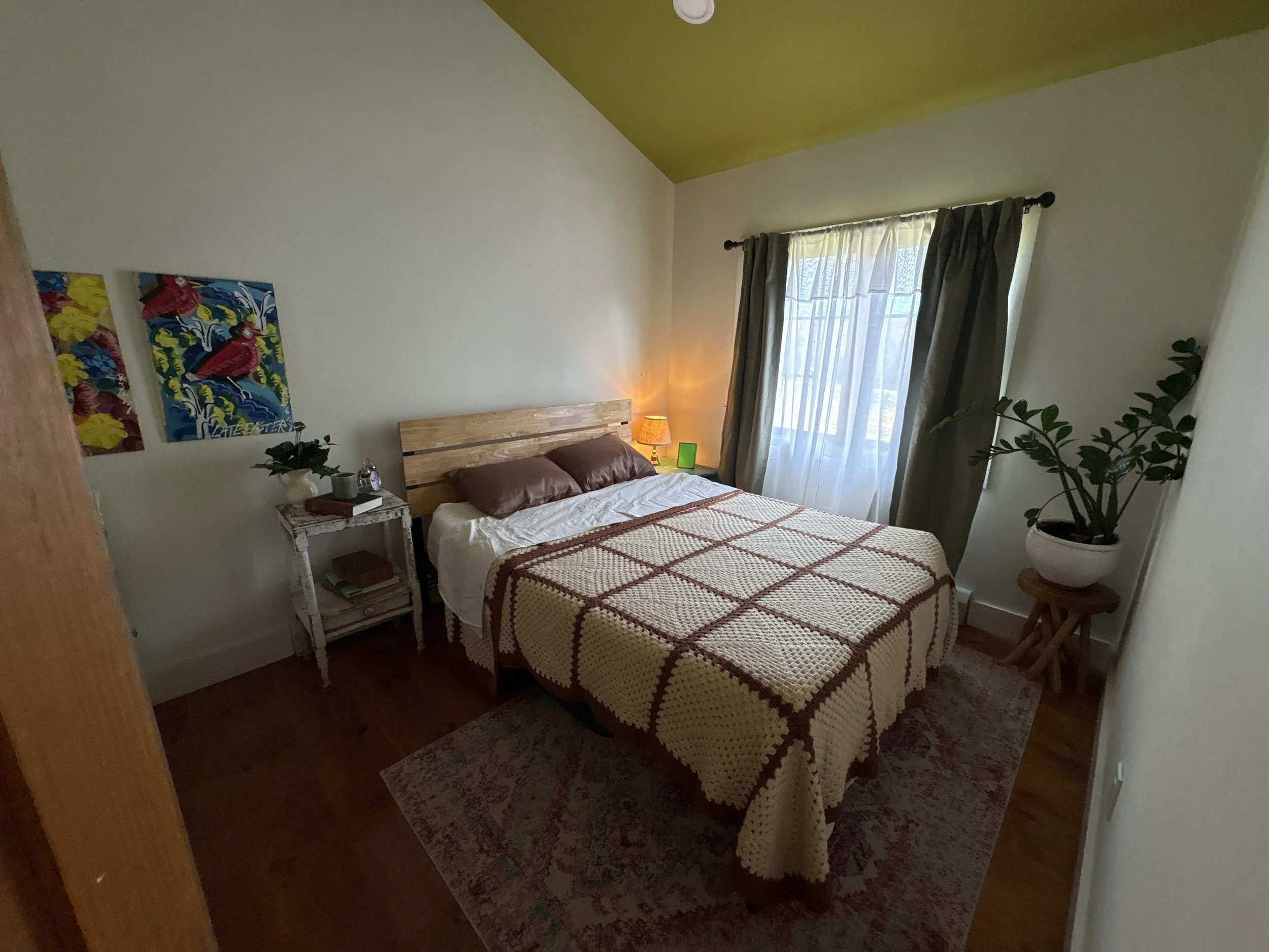 Main character's dressed apartment bedroom.