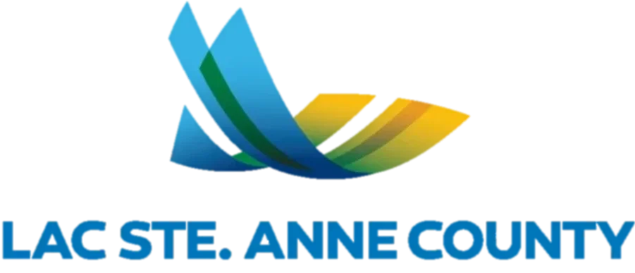 Logo of Lac St. Anne County featuring a stylized wave and sun design in blue, green, and yellow, with the text 'Lac St. Anne County' underneath.