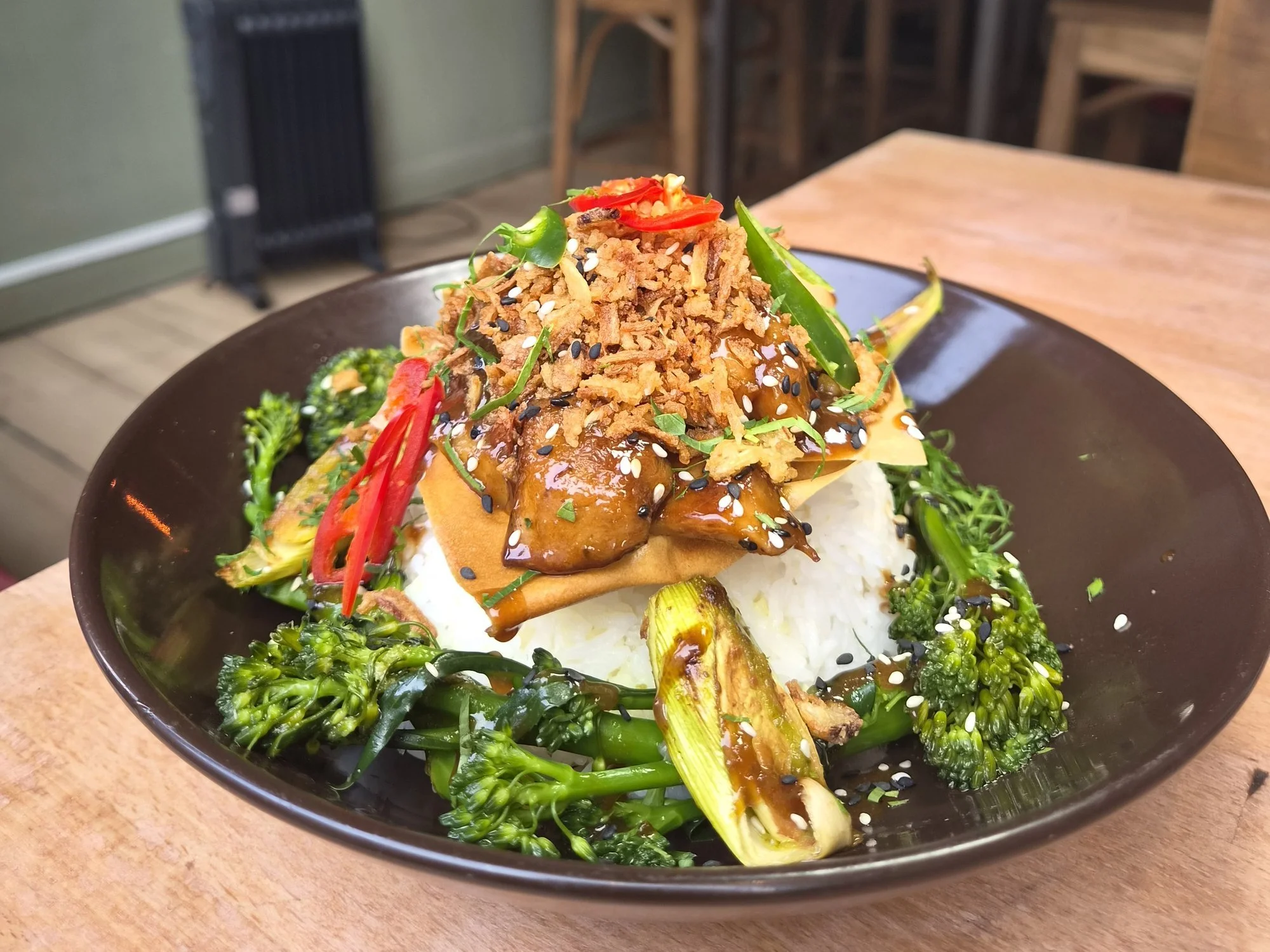 Hoisin oyster mushroom wonton from the evening menu at The Left Bank, on sticky rice with leeks, tenderstem broccoli, chilli and sesame.