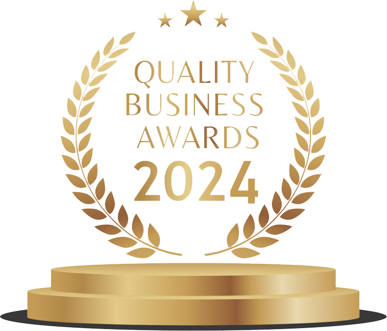 Golden stage with a trophy-like display featuring a circular laurel wreath, stars, and the text "Quality Business Awards 2024".