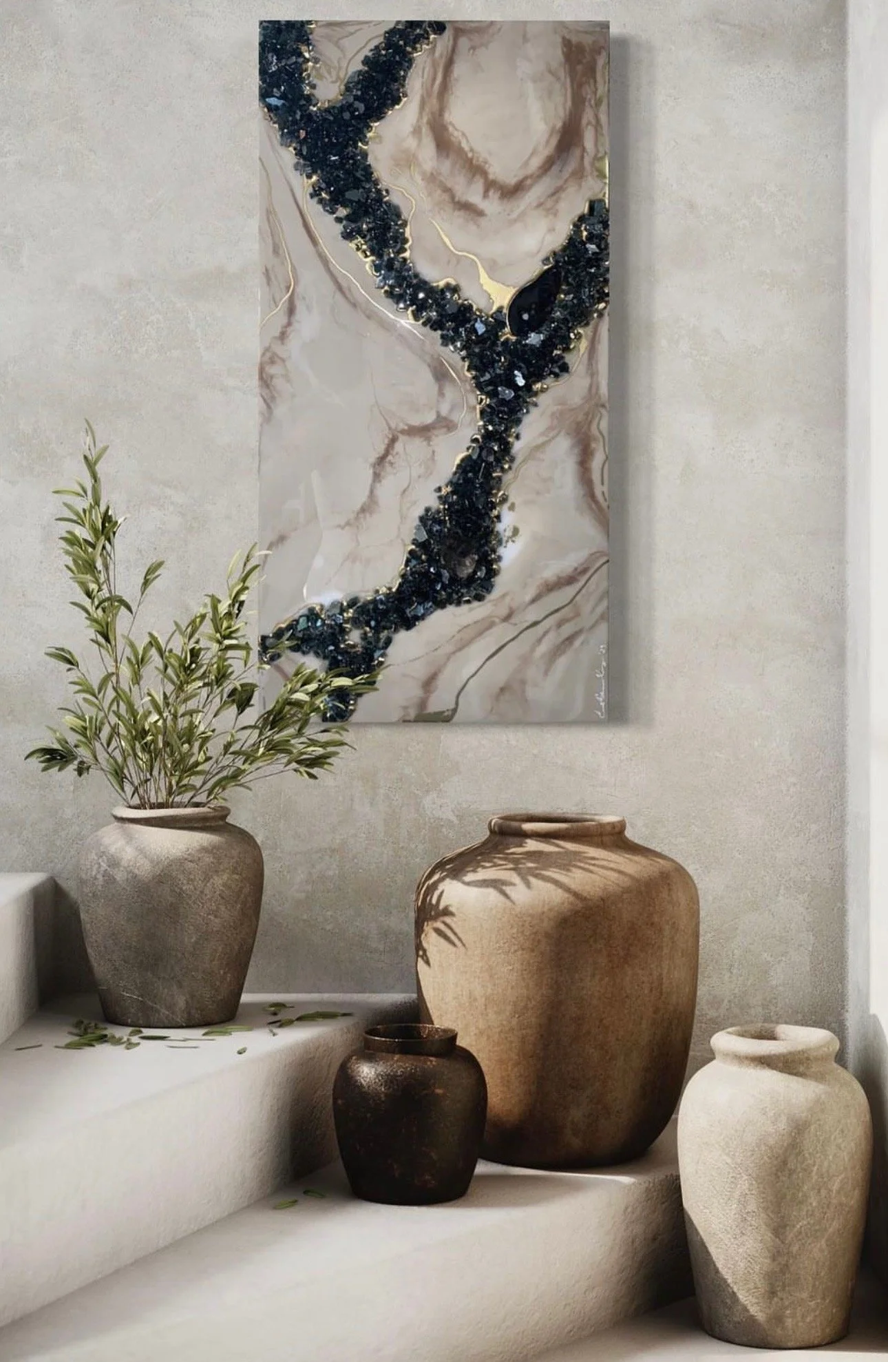 Decorative art piece and various pottery vases with a plant on a white ledge against a light-colored wall.