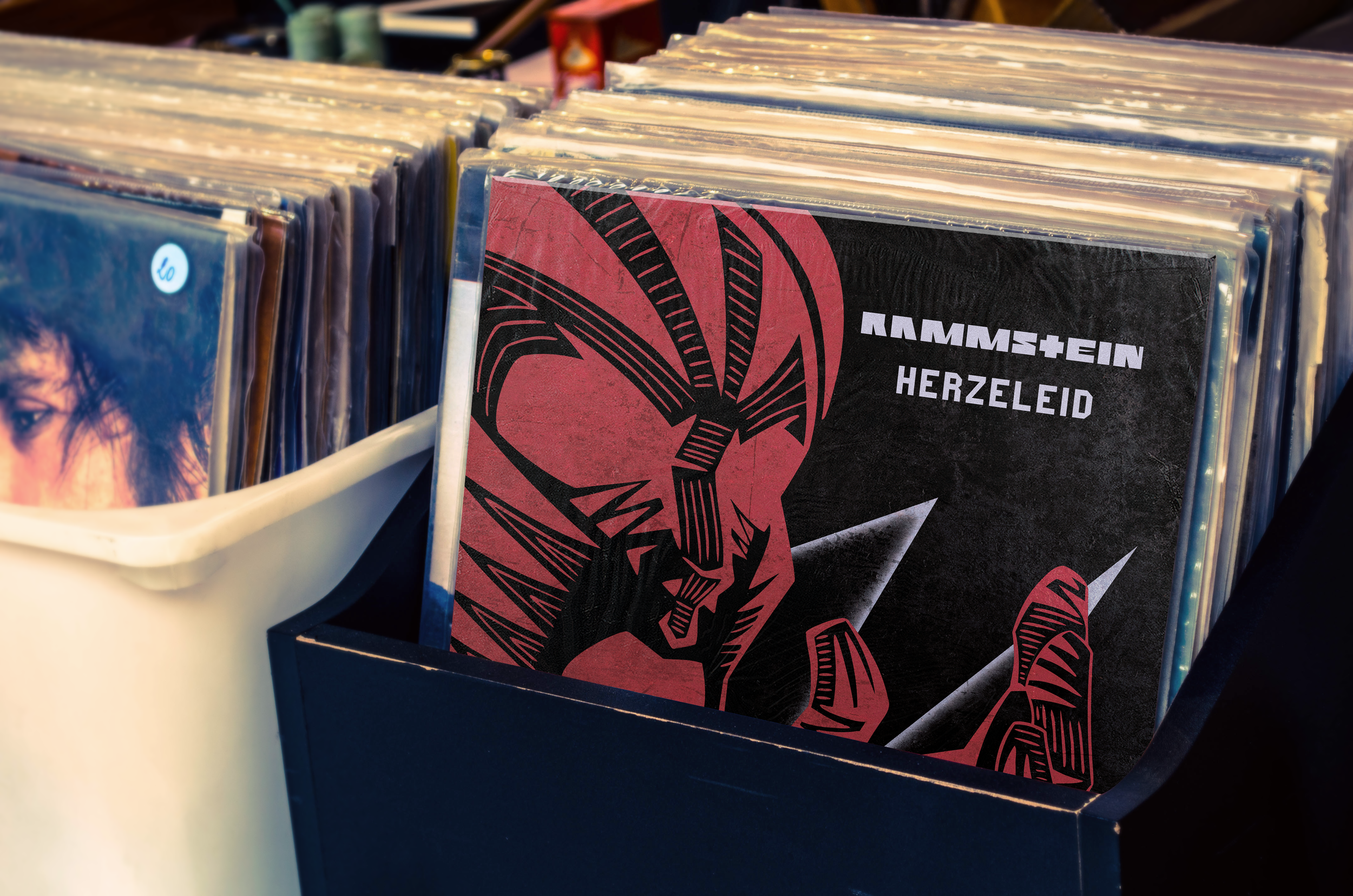 A picture of the album sitting in a record store box.