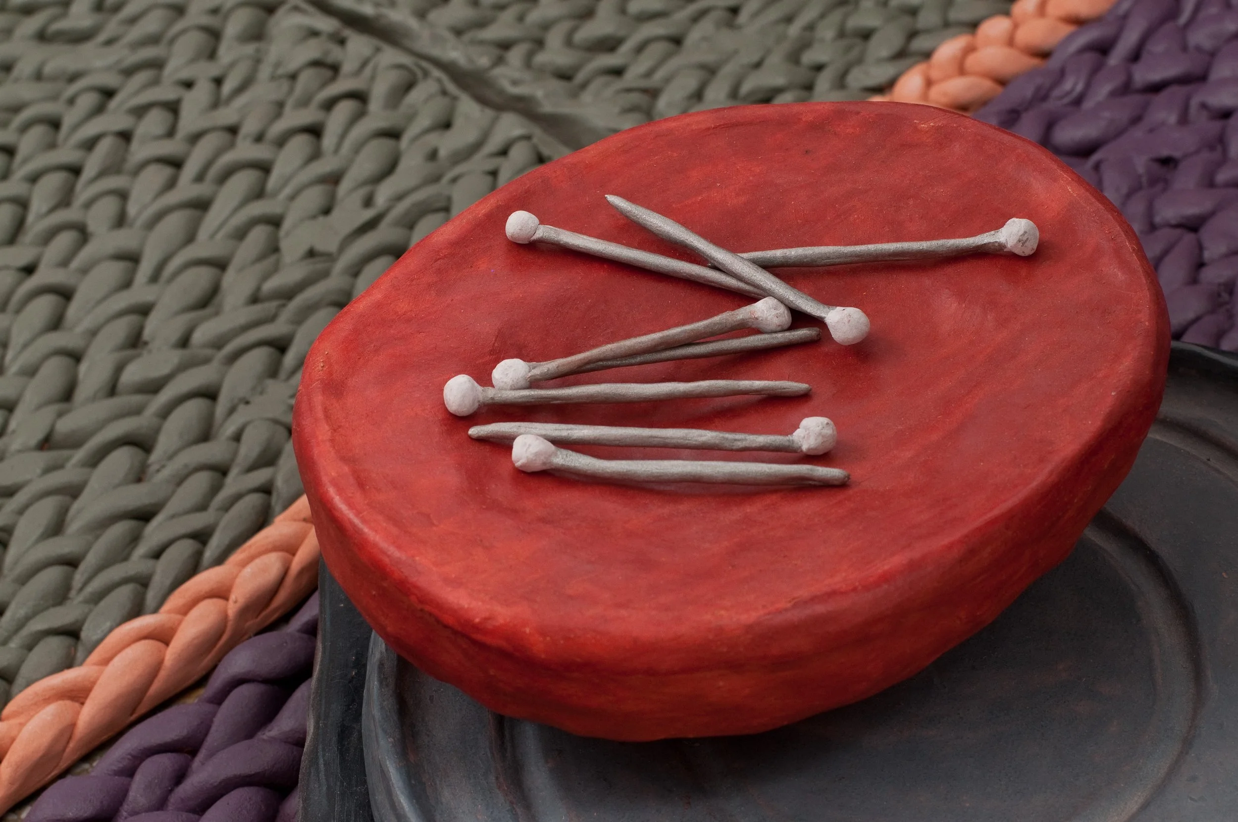 Pins and Magnetic Pin Cushion on Mixer Plate with Braided Rug Close Up

All Low Fire Clay