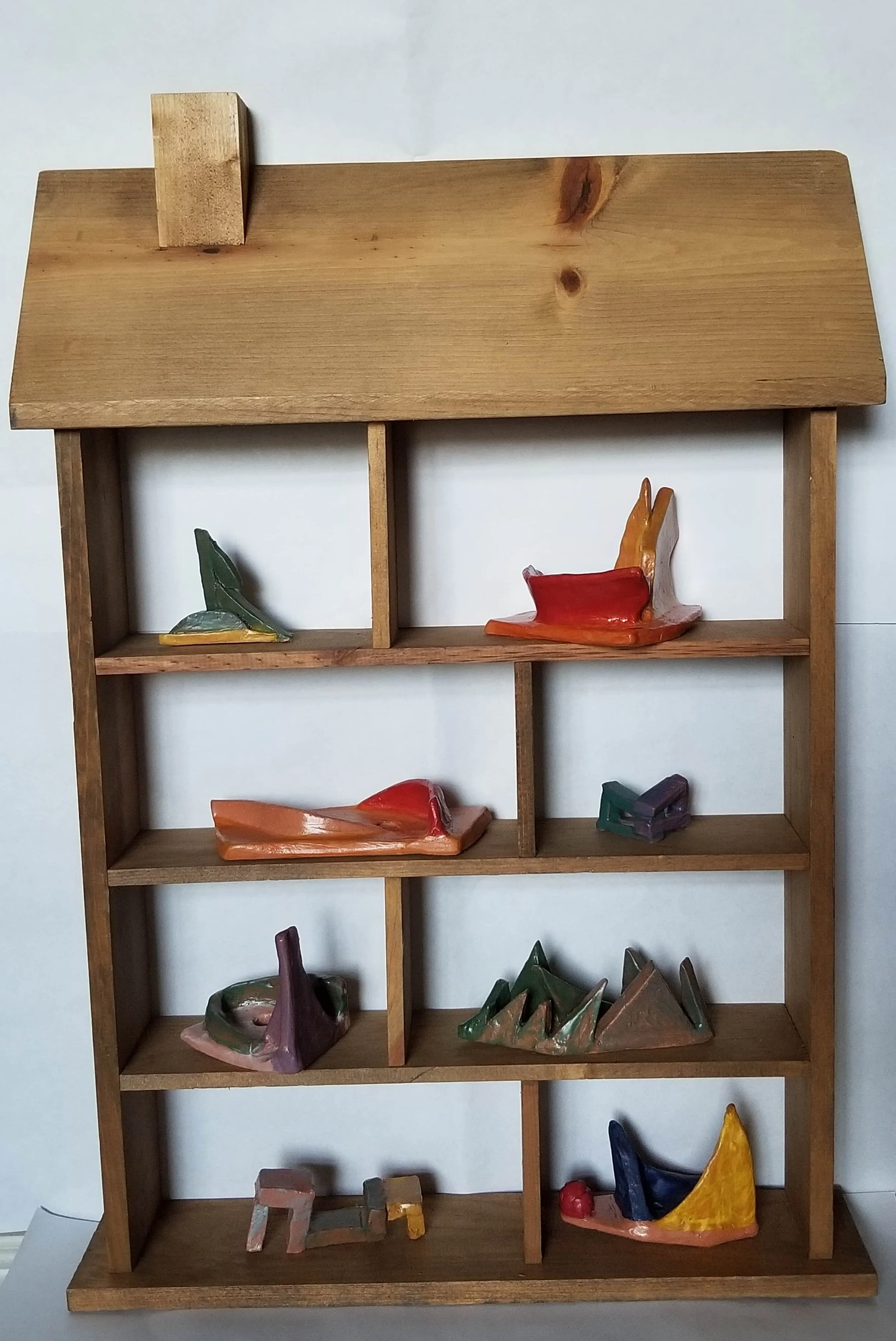 Clay Sketches 

 19” x 14” x 4” 

Low Fire Clay, Underglaze, Glaze, Wood Shelf 

2021