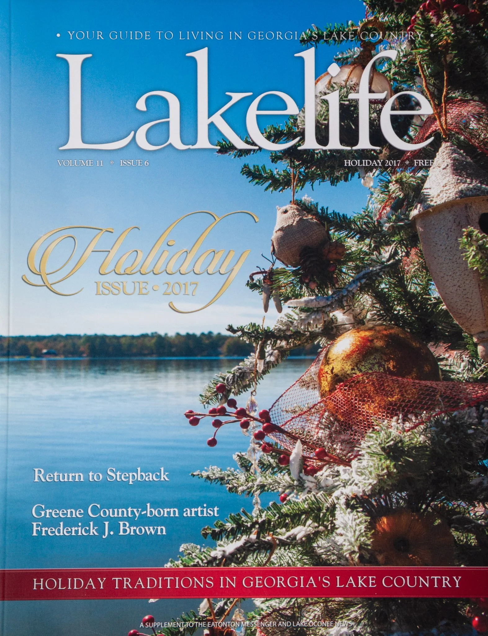 Cover of a magazine titled 'LakeLife,' holiday 2017 issue, featuring a decorated Christmas tree by a lake with a blue sky and water in the background, celebrating holiday traditions in Georgia's Lake Country.