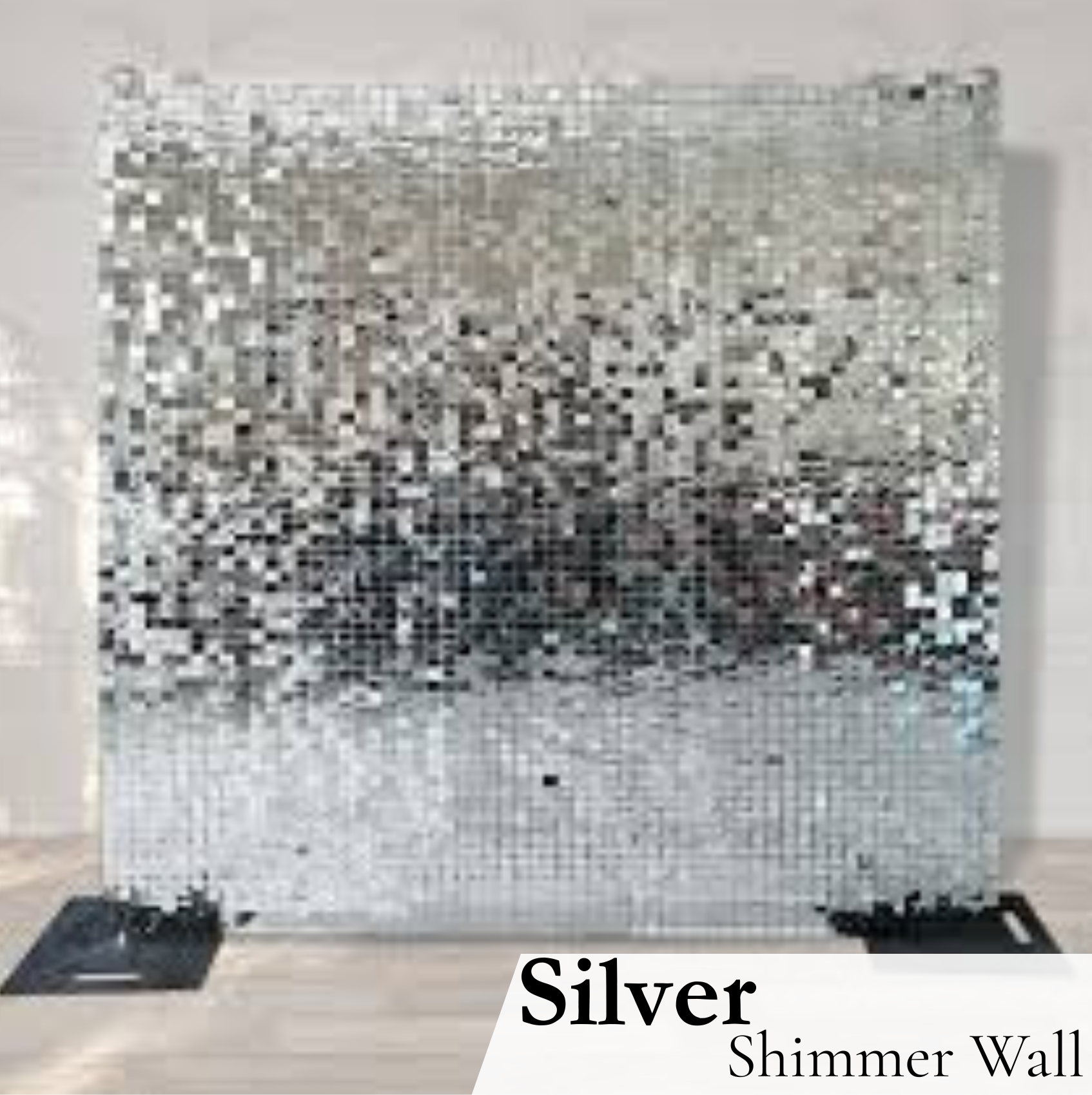 A large silver shimmer wall made of mirrored tiles, displayed on a white wall with a black base at the bottom. The text "Silver Shimmer Wall" is overlaid at the bottom of the image.