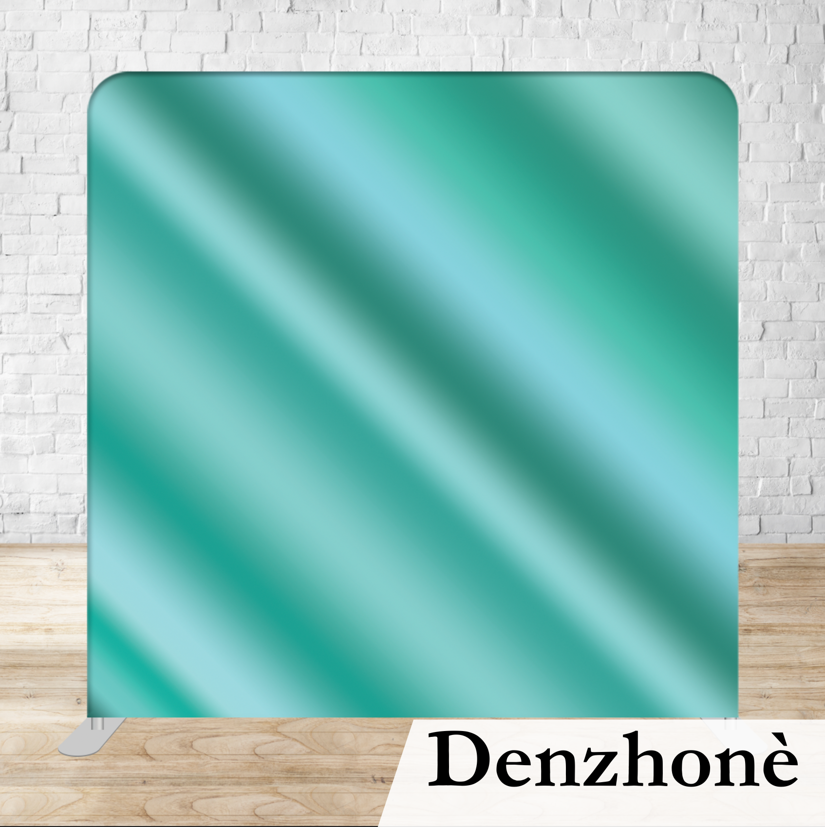 A teal-colored rectangular object with rounded corners and diagonal light reflections, standing on a wooden floor against a white brick wall background with the word 'Denzhône' written in black on a white surface at the bottom.