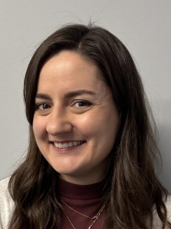 Headshot of Olivia Norris smiling