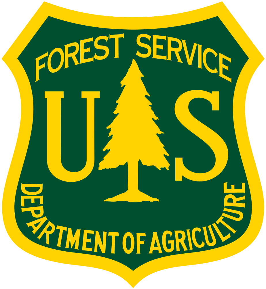 U.S. Forest Service emblem featuring a yellow tree and green background with text.