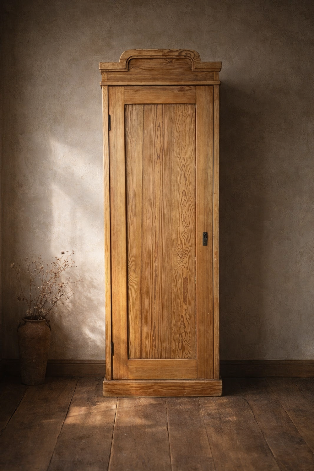 A tall antique pine cupboard or cabinet. Made in the early 20th century. Bring It Home Furniture, Hingham Norfolk.
