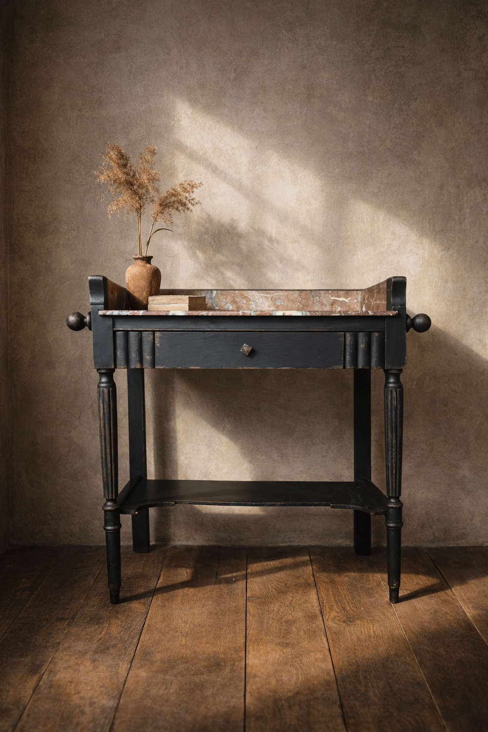 A black painted ebonised 19th century French washstand or console table, with a marble top. Bring It Home Furniture, Hingham Norfolk.