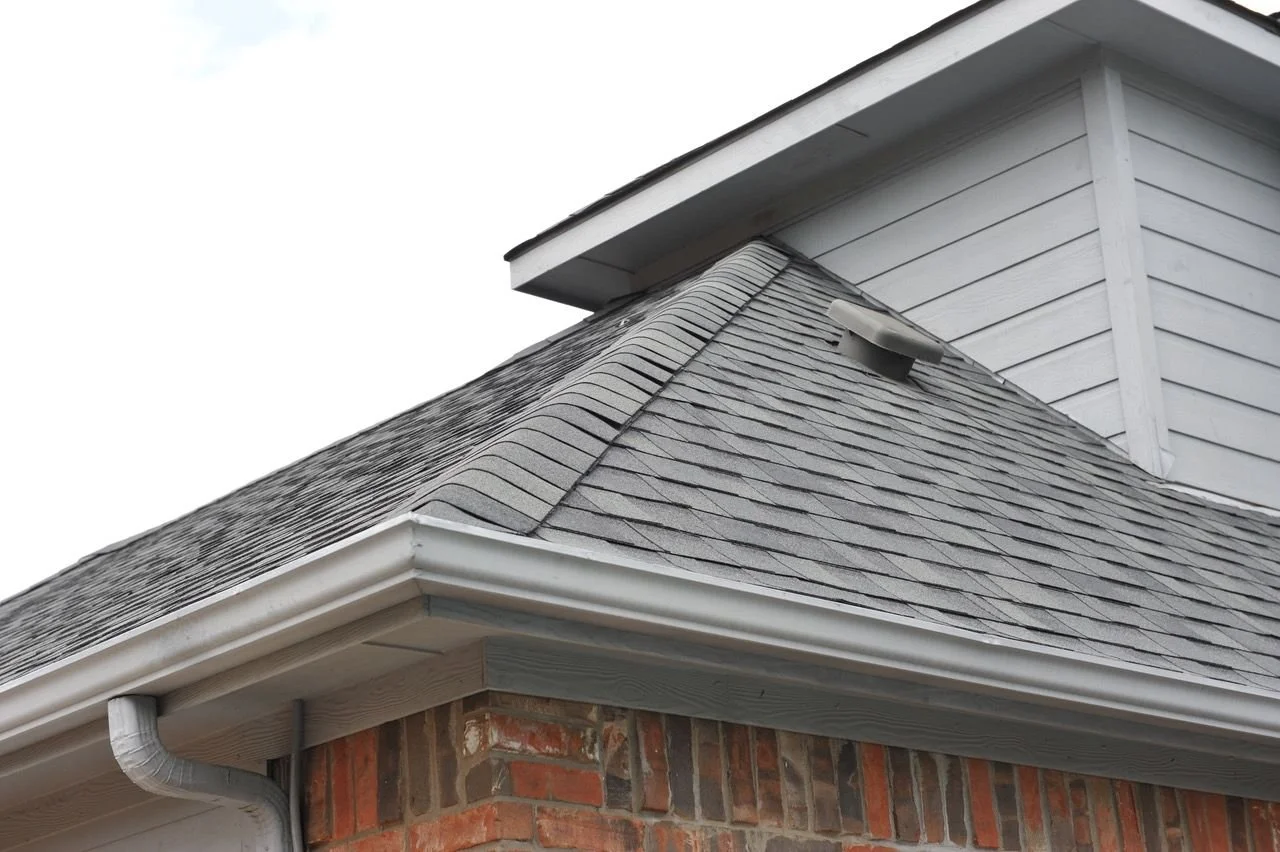 New shingle roof and gutter installed by Christian Brothers Roofing in North Texas