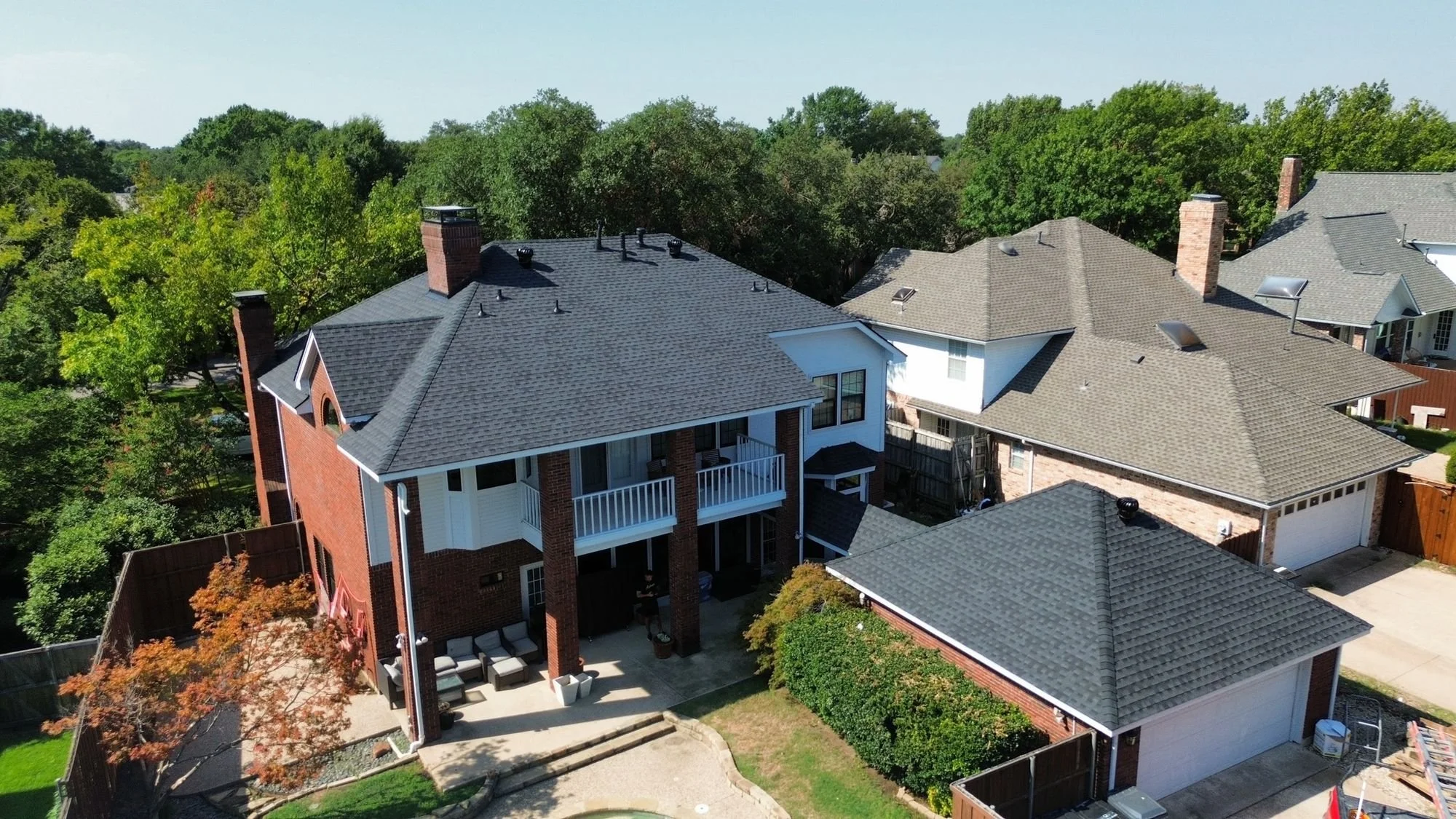 Aerial view of a gray asphalt shingle roof replacement by Christian Brothers Roofing in North Texas