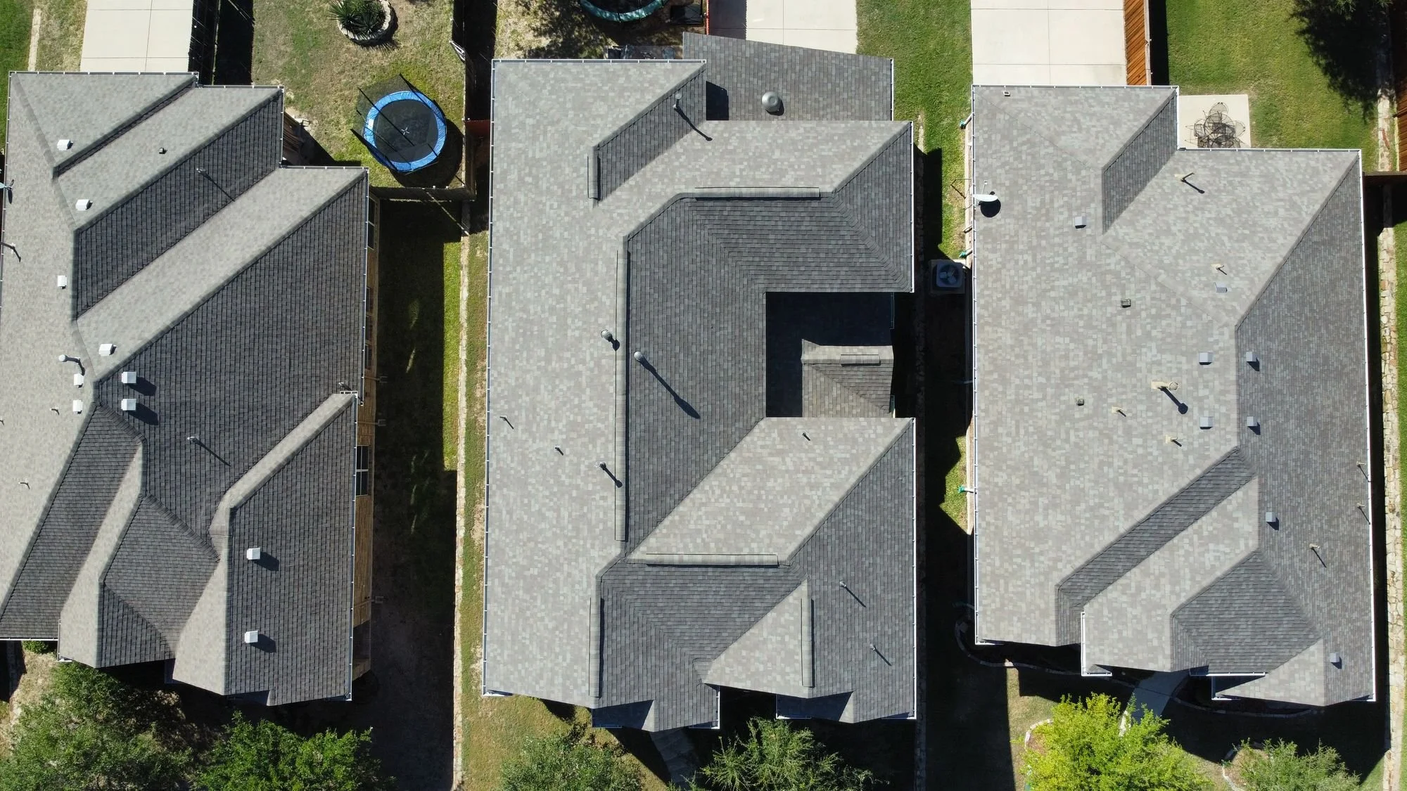 Aerial view of new shingle roofs by Christian Brothers Roofing in a North Texas neighborhood
