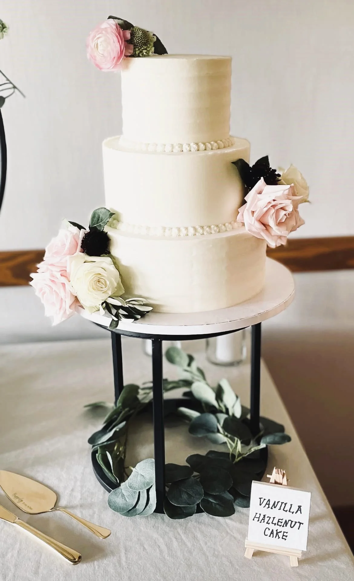 A three-tier vanilla and hazelnut wedding cake