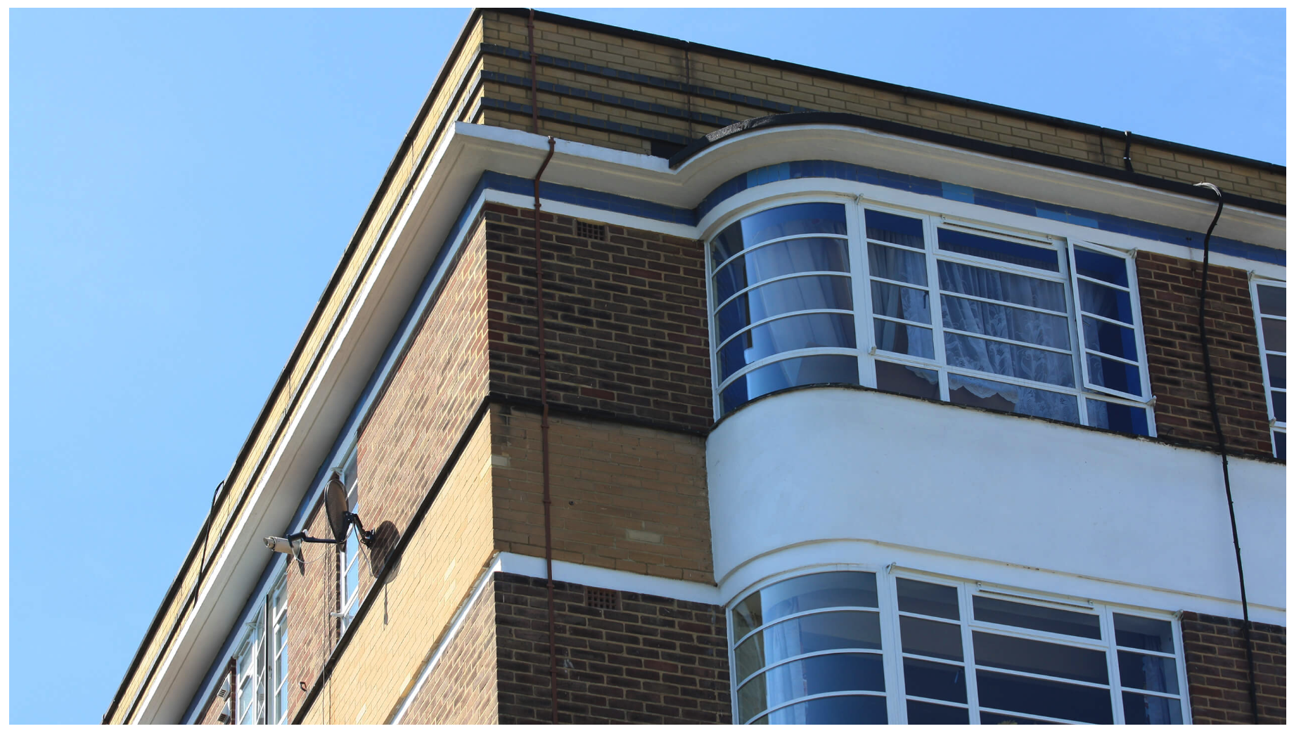 Art Deco White Render Building - Curved Steel Windows
