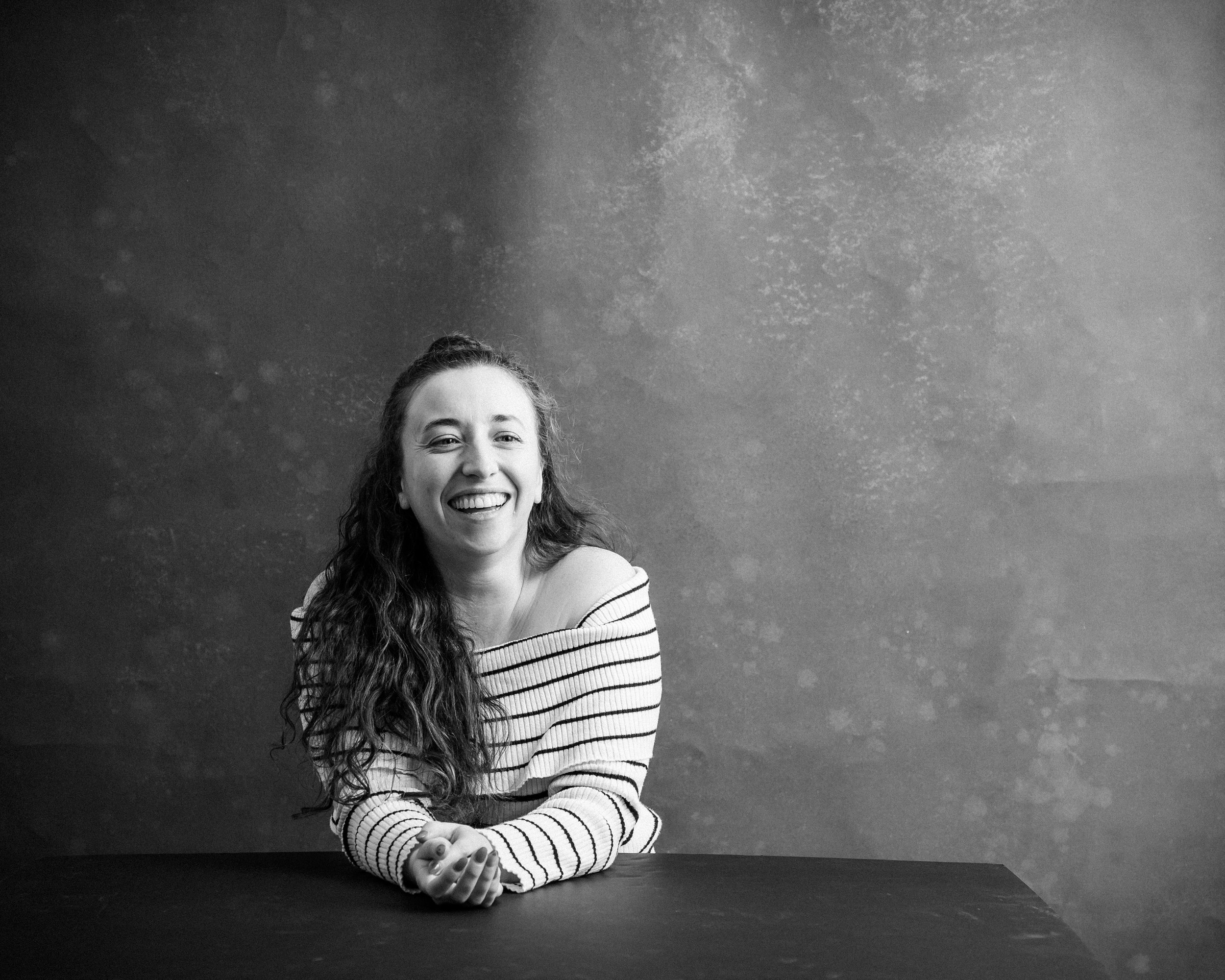 Hannah Laughing, a black and white profile picture
