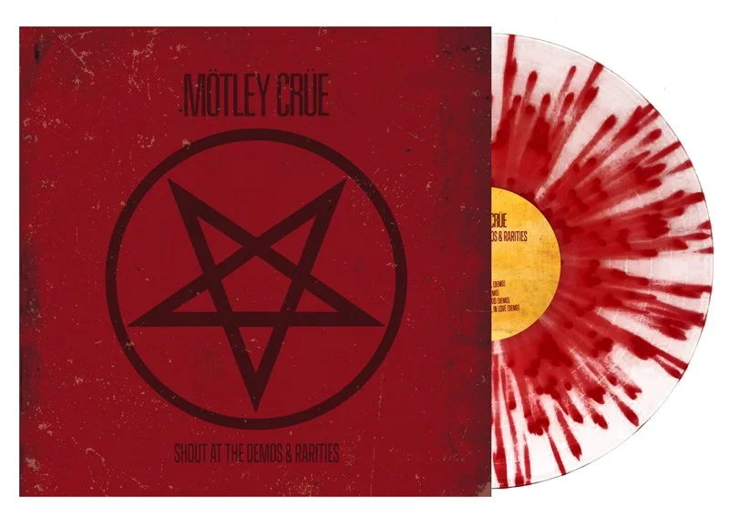 Red vinyl record with red and white splatter pattern. Album cover titled "MOTLEY CRUE" with a black pentagram symbol and text "SHOUT AT THE DEMOS & RARITIES".