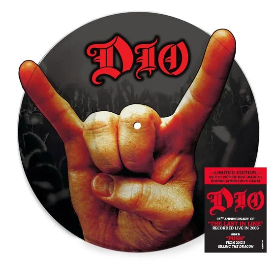 A hand making the rock and roll gesture with the index and pinky fingers raised, against a black background with the word 'DIO' in red at the top.