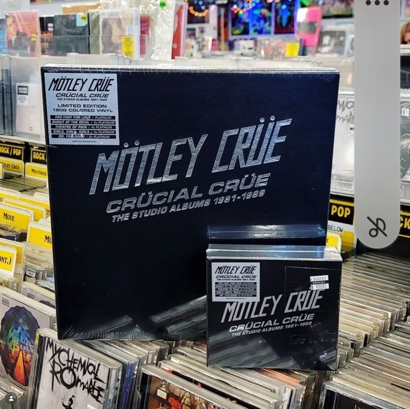Box set of Mötley Crüe's album 'Crüe' Crucial Crüe, The Studio Albums 1981-1989, displayed on a store shelf among other music albums.