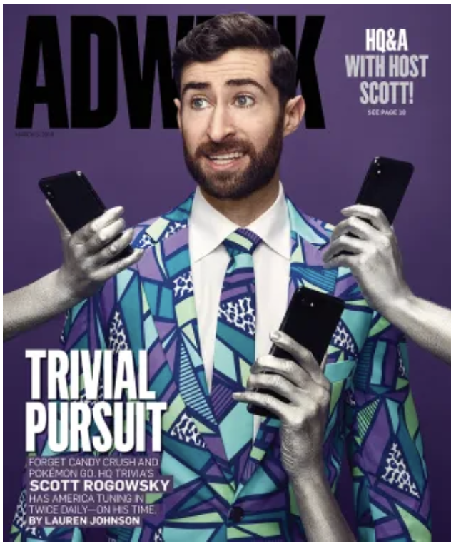 Cover of ADWEEK magazine featuring a man with a beard in a colorful geometric patterned suit holding multiple smartphones, with hands reaching out towards him, set against a purple background. The cover text mentions a trivia pursuit with Scott Rogowsky.