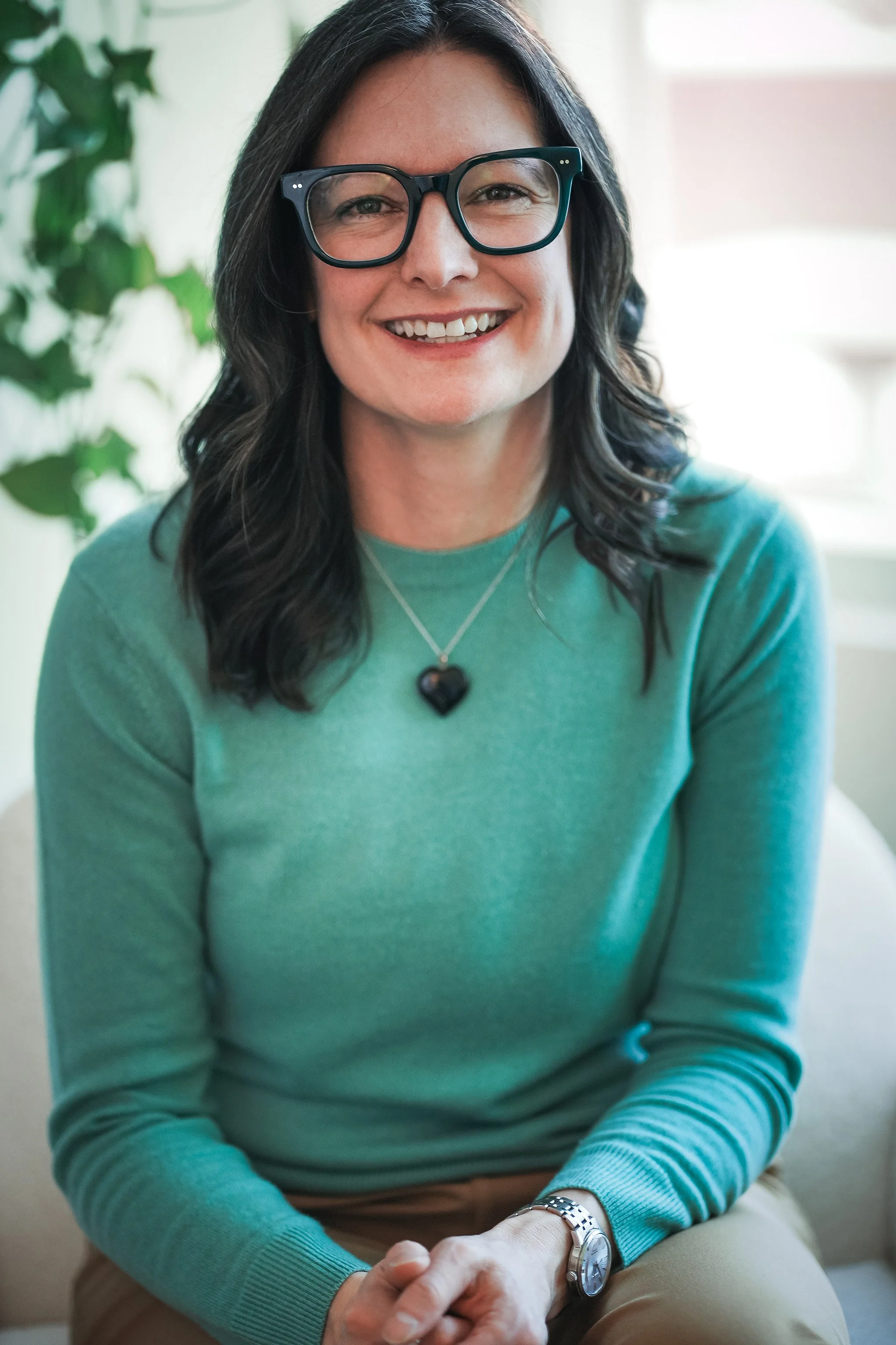 Lori Johnstone, owner and lead therapist at Canopy & Co. Psychology, presenting her therapy services
