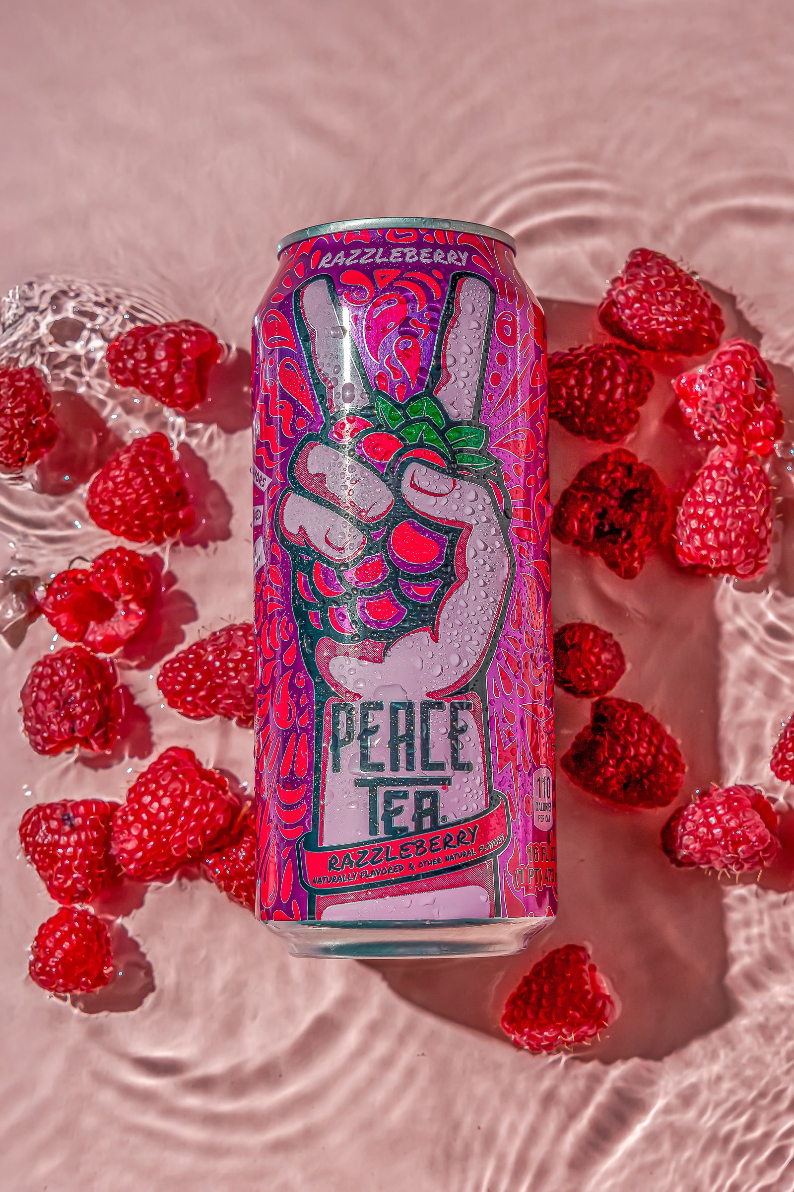 Red Bull Pink Edition | Berry Product Styling
Commercial beverage photography featuring a Peace Tea Razzleberry can with a dynamic water splash and fresh raspberries. This high-action shot demonstrates expertise in liquid motion, condensation styling