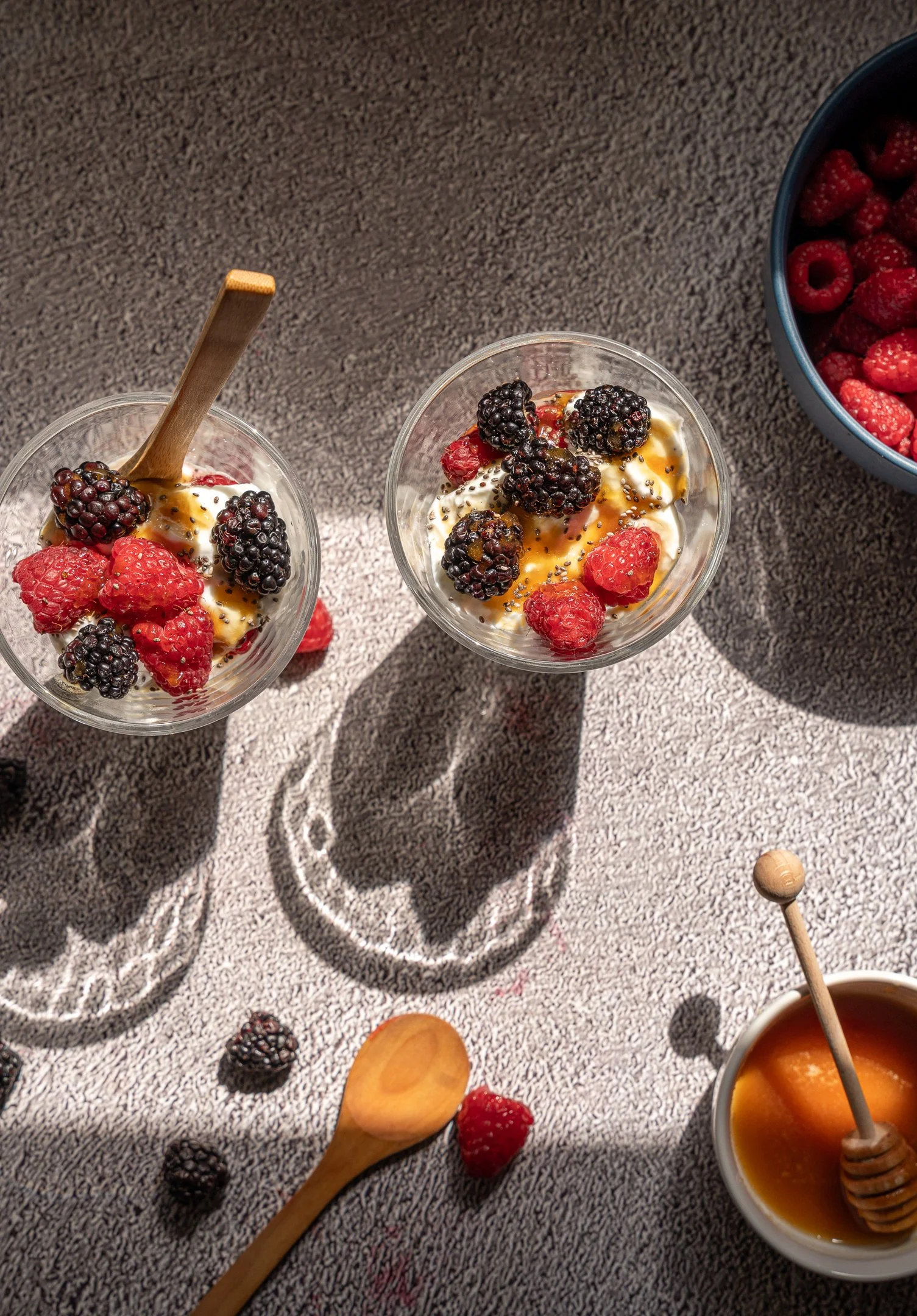 Artisanal Berry Yogurt & Honey Detail
Bright editorial food photography featuring fresh raspberries, blackberries, and honey drizzles, highlighting vibrant breakfast textures and natural light.