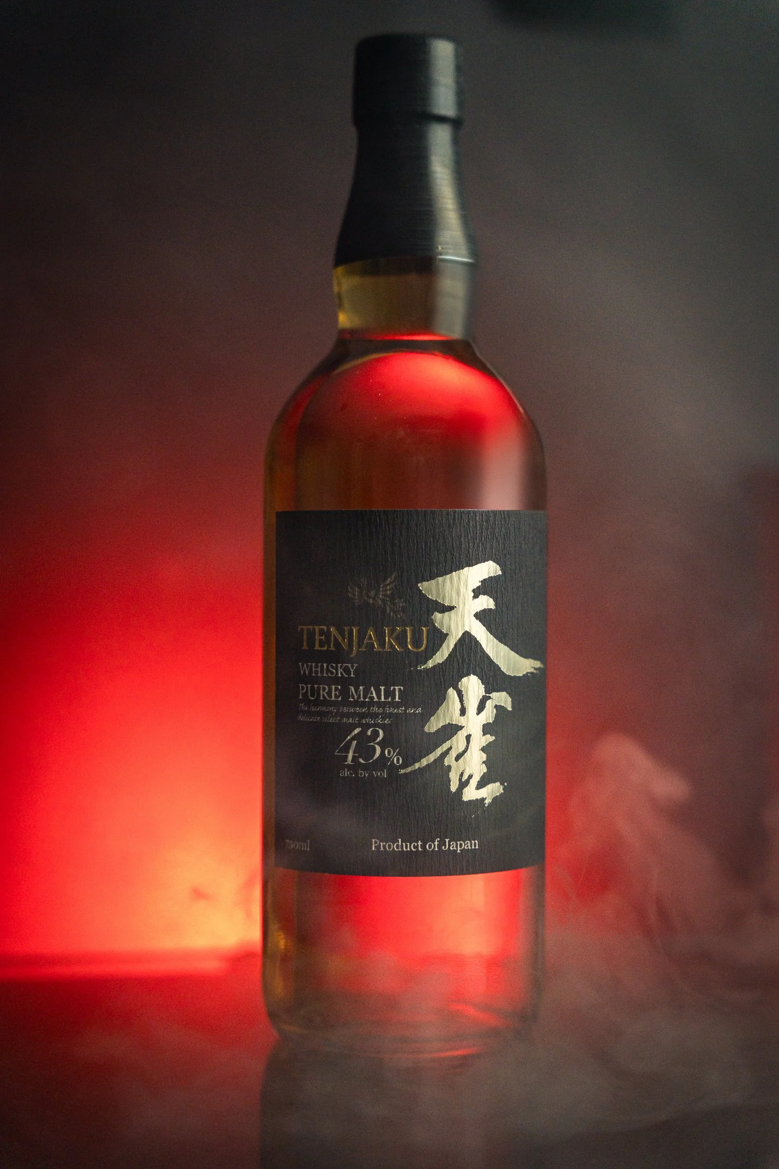 Tenjaku Whisky | Cinematic Spirits Photography
Dramatic product photography of Tenjaku Pure Malt Japanese Whisky. This commercial beverage shot features a glowing red backlight, atmospheric smoke, and a minimalist black background, highlighting the g