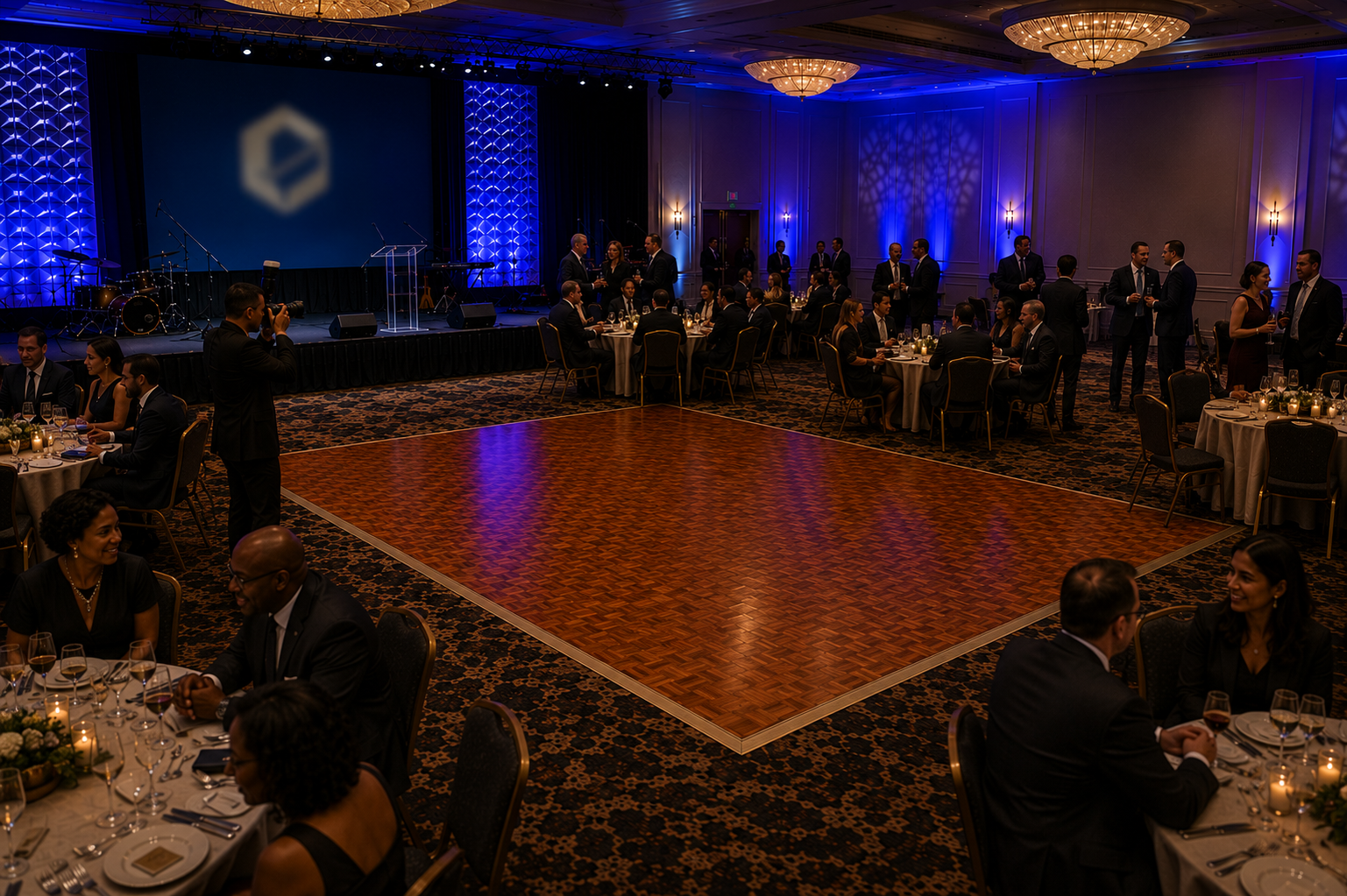 Elegant corporate gala featuring a classic parquet dance floor surrounded by banquet tables in a luxury ballroom, ideal for awards ceremonies, fundraising galas, holiday parties, and corporate event rentals throughout Baltimore, Maryland.