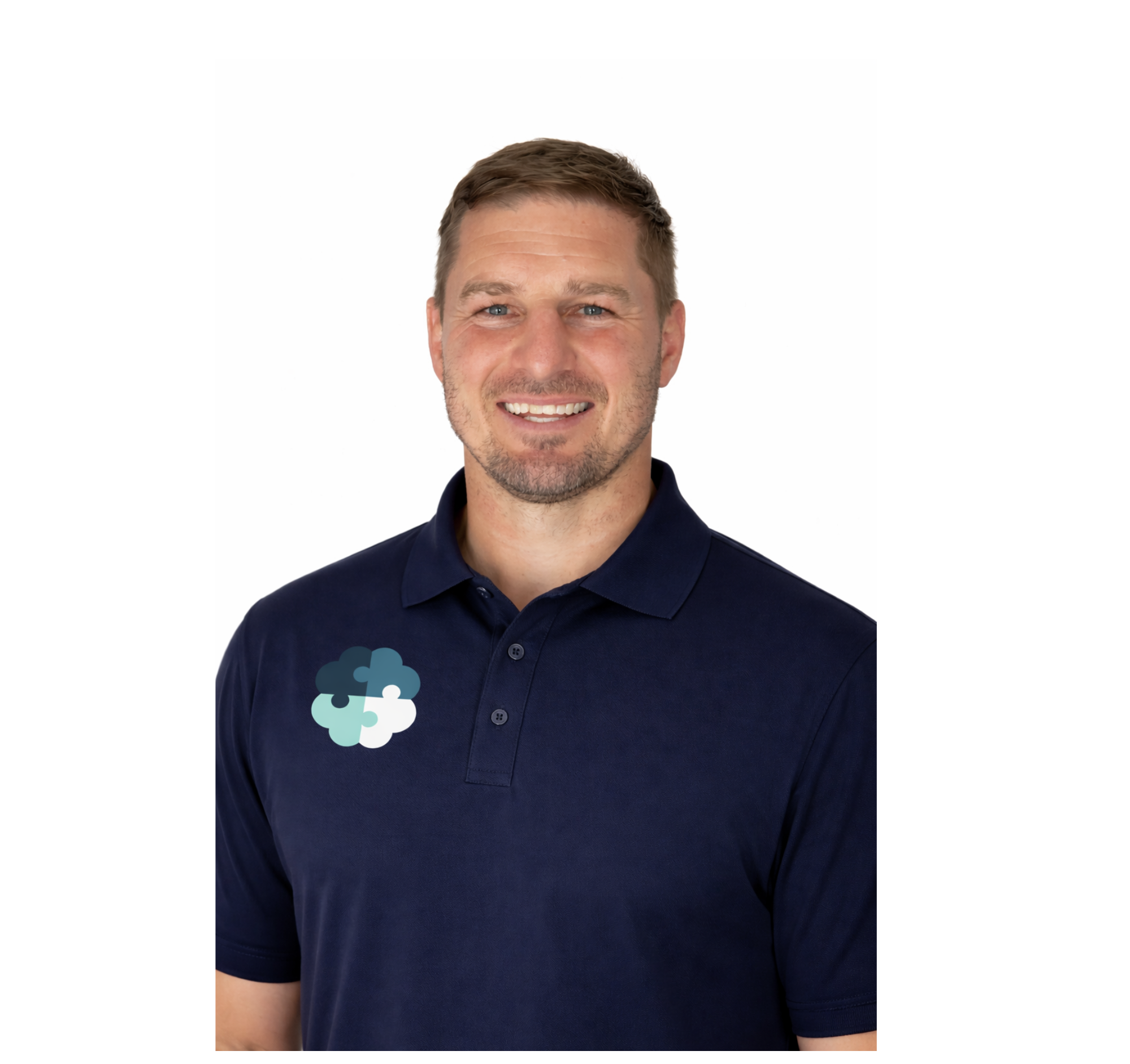 A smiling man with short brown hair and a beard wearing a navy blue polo shirt with a small cloud-shaped logo on the chest.